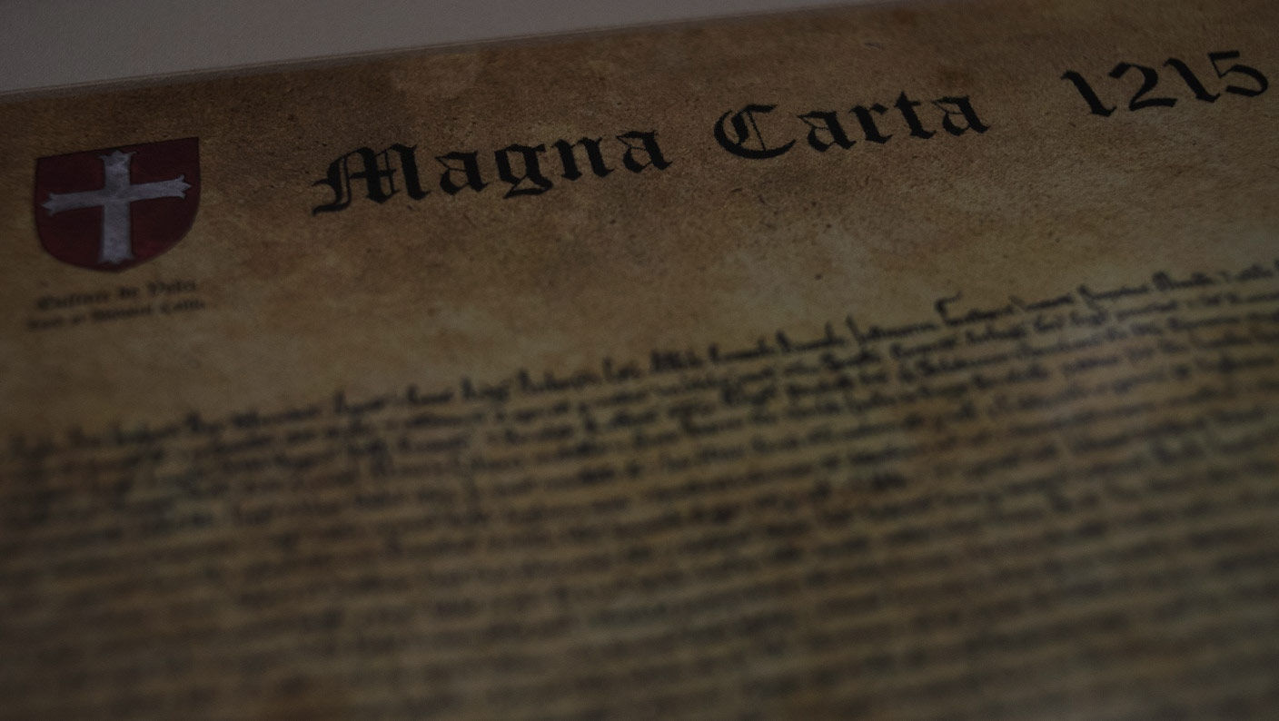Close-up of a historic Magna Carta legal document with a wax seal